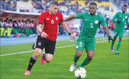  ??  ?? Super Eagles defender, Kalu Okogbue attempts to check Libyan Mohammed Aleyat during the last group match which Nigeria won by a lone goal