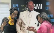  ?? Picture: IHSAAN HAFFEJEE ?? THEIR HERO: Women pose for pictures with a cardboard cutout of Pastor Alph Lukau
