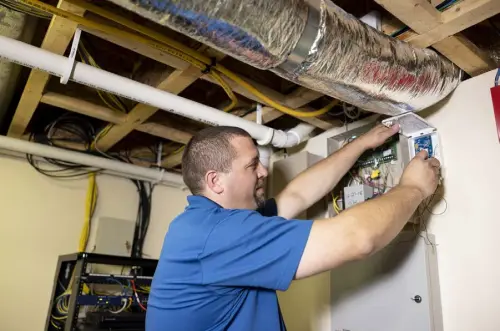  ?? ?? Dave Vermilya, a project manager at Custom Alarm, updates a system in a home in Rochester, Minn., on Sept. 13. Businesses whose products and services depend on older wireless technology are racing to meet a pending February 2022 sunset of 3G wireless service.