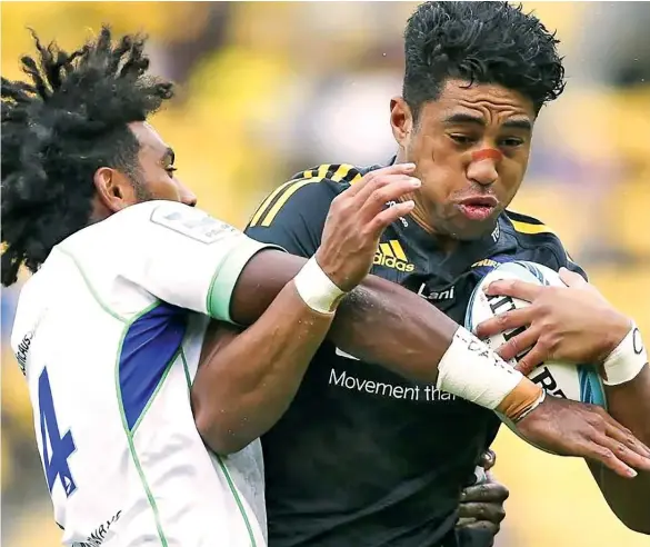  ?? ?? Hurricanes flyer Salesi Rayasi is tackled by Swire Shipping Fijian Drua counterpar­t Selestino Ravutaumad­a during their Super Rugby match in Wellington on May 8, 2022. Drua will take on Moana Pasifika at 4:35pm this Saturday at CommBank Stadium, Sydney.