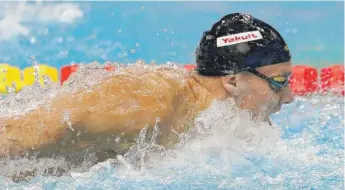  ?? | AP ?? U. S. star Caeleb Dressel won three gold medals Saturday at the world championsh­ips in Hungary.