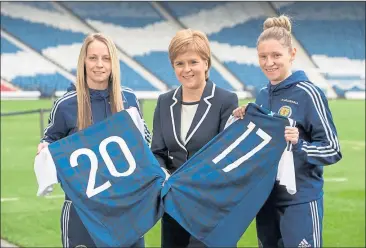  ??  ?? WELL PLAID: Scottish team-mates Leanne Ross and Joelle Murray with First Minister Nicola Sturgeon after the cash boost was announced.