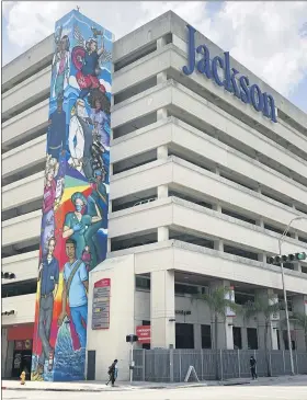  ?? WILFREDO LEE — THE ASSOCIATED PRESS ?? An mural pays tribute to front line healthcare workers at Jackson Memorial Hospital in Miami. Florida is reporting huge increases in Covid-19 cases since reopening for business.