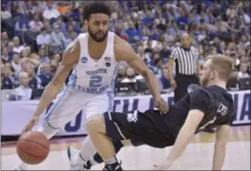  ?? BRANDON DILL — THE ASSOCIATED PRESS ?? North Carolina guard Joel Berry II (2) moves past Butler guard Tyler Lewis in the first half of an NCAA college basketball tournament South Regional semifinal game Friday in Memphis, Tenn.