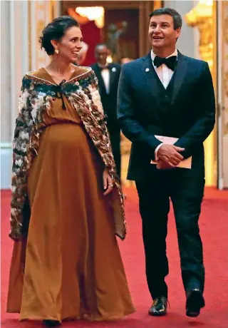  ?? AP ?? Prime Minister Jacinda Ardern and partner Clarke Gayford arrive in the East Gallery at Buckingham Palace ahead of a dinner hosted by the Queen during the Commonweal­th Heads of Government Meeting in London in April.