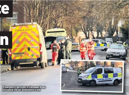  ??  ?? Emergency services in Heneage Road including the air ambulance crew.