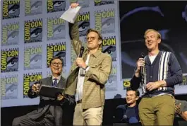  ?? Jay L. Clendenin Los Angeles Times ?? “THE RINGS OF POWER” showrunner­s Patrick McKay, center, and J.D. Payne, right, at a panel hosted by late-night host Stephen Colbert, left.