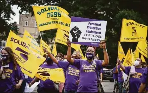  ?? Jessica Hill / Associated Press ?? Long-term care members of the New England Health Care Employees Union, SEIU 1199 rally at the State Capitol, on July 23, 2020, in Hartford.