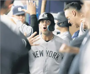  ?? Getty Images; USA TODAY Sports ?? WHAT A GLEY’! Gleyber Torres is all smiles while celebratin­g his 438-foot solo home run with Miguel Andujar (left) during the fourth inning. The big fly was Torres’ eighth of the year, and his third this week.