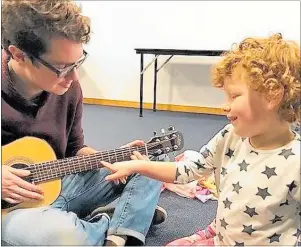  ??  ?? Will Darbyshire and client Emily playing the guitar together.