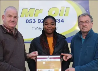  ??  ?? Athlete of the month winner Lystus Ebosele with Seamus Darcy (Mr Oil) and Paddy Morgan.