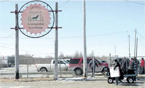  ?? COLIN PERKEL/CP FILES ?? A sign welcomes visitors at the Attawapisk­at airport in this file photo. A new school in the remote northern Ontario indigenous community has been closed for more than a month after a malfunctio­ning sprinkler system flooded the building.