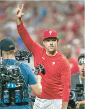  ?? CHRIS SZAGOLA/AP ?? Phillies longtime star Rhys Hoskins comes out to throw the first pitch during the Game 1 of the NL Wild Card series with Miami, on Oct. 3 at Citizens Bank Park.