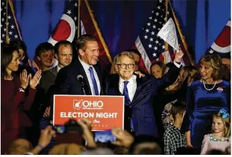  ?? JONATHAN QUILTER / THE COLUMBUS DISPATCH ?? Governor-elect Mike DeWine and Lieutenant Governor-elect Jon Husted take the stage on election night at the GOP celebratio­n in Columbus.