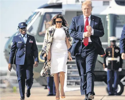  ?? PHOTO: JOE RAEDLE/GETTY IMAGES ?? Departure:
Donald Trump and First Lady Melania walk towards Air Force One at Joint Base Andrews in Maryland.