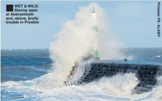  ??  ?? ®ÊWET &amp; WILD: Stormy seas at Aberystwyt­h and, above, brolly trouble in Preston