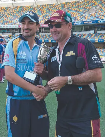  ?? Picture: BRENDAN WEST ?? WELL PLAYED: Far North Fusion captain Michael Salerno accept the Bulls Masters T20 Country Challenge trophy from Jimmy Maher.