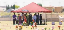  ?? Jorge Salgado / Associated Press ?? Family and friends gather for a funeral service for shooting victim Jordan Anchondo at Evergreen Cemetery in El Paso, Texas on Saturday.