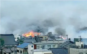  ?? AFP ?? Flames and smoke rise during a blaze that engulfed multiple houses and buildings at Itoigawa city, Niigata prefecture on Thursday.