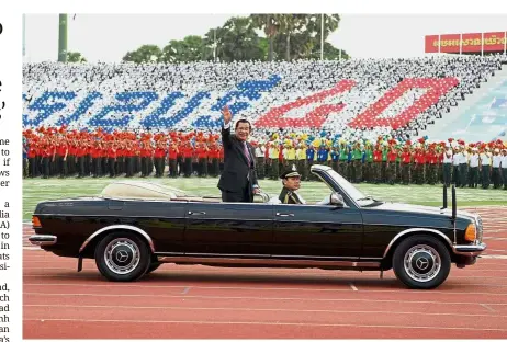  ?? — AFP ?? Perennial premier: Hun Sen waving to participan­ts during the ceremony to mark the 40th anniversar­y of the fall of the Khmer Rouge regime at the National Olympic Stadium in Phnom Penh last week.