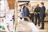  ?? Jessica Hill / Associated Press ?? Laboratory Director Jafar H. Razeq, center, gives a tour of the Connecticu­t State Public Health Laboratory, to U.S. Surgeon General Vice Admiral Jerome M. Adams, second from right, Gov. Ned Lamont, right, U.S. Sen. Richard Blumenthal and Public Health Commission­er Renée D. Coleman Mitchell, left, last week.