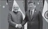  ?? PIB FILE ?? Narendra Modi with Chinese President Xi Jinping on the sidelines of the 9th BRICS Summit in Xiamen, China.