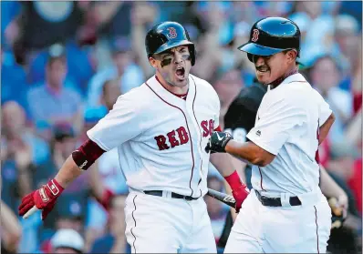  ?? MICHAEL DWYER/AP PHOTO ?? Steve Pearce of the Boston Red Sox, left, reacts after Tzu-Wei Lin, right, scored the go-ahead run on a sacrifice fly by Andrew Benintendi during the eighth inning of Sunday’s game against the New York Mets in Boston.