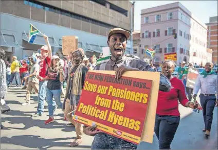  ?? Photo: Hanna Brunlöf ?? Ethics under fire: Protesters demonstrat­e against CPS and Net1 selling life insurance policies to social grant recipients. The high court has effectivel­y deemed such debit orders legal.