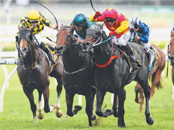  ?? Picture: GETTY IMAGES ?? TRIUMPHANT END: Jim Cassidy rides Dissident ( right) to victory in the All Aged Stakes at Royal Randwick on Saturday.