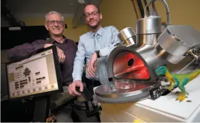  ?? CP PHOTO ?? Professors Maikel Reinstadte­r, right, and Ralph Pudritz pose for a photo with the planet simulator in the Origins of Life Laboratory at McMaster University in Hamilton, Ont., on Wednesday.