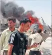  ?? Photo: REUTERS ?? Fierce fighting: Members of the Syrian Free Army walk in front of a damaged tank in Idlib.