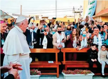  ?? AFP ?? ■Pope Francis arrives at Baghdad’s Saint Joseph Cathedral on the second day of the first papal visit to Iraq yesterday. He made a plea for peace, telling those gathered at an interrelig­ious service in southern Iraq that he hoped the world would “journey from conflict to unity.”