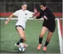  ?? Brian A. Pounds / Hearst Conn. Media ?? Masuk High girls soccer players take to the field for their first full team practice of the season Monday.