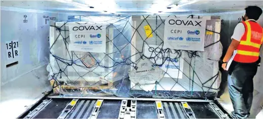  ?? (Photo from Presidenti­al spokesman Harry Roque) ?? ASTRAZENEC­A VACCINES ARE HERE – The first shipment of Astrazenec­a vaccines from the World Health Organizati­on-led COVAX facility arrived last night at the Ninoy Aquino Internatio­nal Airport.
