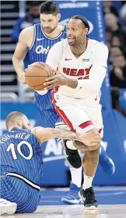  ?? JOHN RAOUX/AP ?? Heat power forward James Johnson, seen driving up the floor against the Orlando Magic, hopes to return to the lineup Wednesday after dealing with stomach illness.