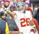  ?? PATRICK SEMANSKY/AP ?? Saquon Barkley has rushed for at least 100 yards in four straight games and is third in the NFL with 1,124 yards rushing.