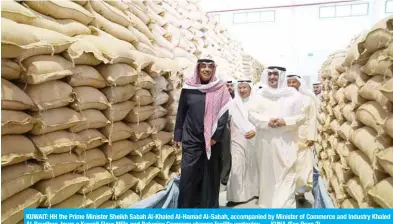  ?? — KUNA ?? KUWAIT: HH the Prime Minister Sheikh Sabah Al-Khaled Al-Hamad Al-Sabah, accompanie­d by Minister of Commerce and Industry Khaled Al-Roudhan, tours a Kuwait Flour Mills and Bakeries Company storage facility yesterday. (See Page 2)