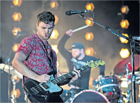  ??  ?? Royal Blood – Ben Thatcher, below left, and Mike Kerr, below right – perform on stage at the NOS Alive festival in Lisbon in the summer