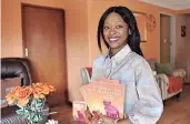  ?? | THOBILE MATHONSI
African News Agency (ANA) ?? MARCIA Ramodike from Mamelodi with a copy of her book, From An Empty Pride To A Full Price.