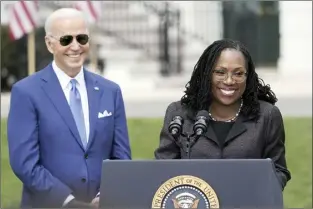  ?? AP file photo ?? President Joe Biden listens as Judge Ketanji Brown Jackson speaks during an event on the South Lawn of the White House in Washington on April 8, celebratin­g the confirmati­on of Jackson as the first Black woman to reach the Supreme Court. Overall, 48 percent of Americans say they approve and 19 percent disapprove of Jackson’s confirmati­on to the high court according to the new poll from The Associated Press-NORC Center for Public Affairs Research. The remaining 32 percent of Americans hold no opinion.