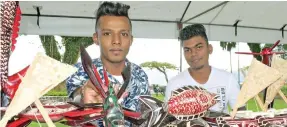  ?? Photo: Ronald Kumar ?? Praneel Prasad (left) and Roneel Kumar with some of their handicraft on sale during the Open Market Day at Ratu Sukuna Park on August 7, 2020.