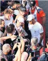  ??  ?? MOBBED Fans in Monza surround champ Hamilton