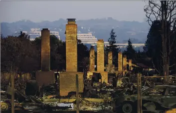  ?? JAE C. HONG — THE ASSOCIATED PRESS FILE ?? A row of chimneys stand in a neighborho­od devastated by the Tubbs fire near Santa Rosa.