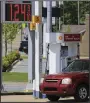  ?? (Arkansas Democrat-Gazette/ Staton Breidentha­l) ?? A motorist fills up his vehicle Monday at a convenienc­e store in Sherwood.