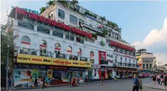  ??  ?? Truc Bach Lake, where the late John McCain was shot down during the Vietnam War; the Old Quarter; and a typically lively Hanoi bar scene