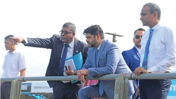  ?? Photo: Ministry of Environmen­t ?? Minister for Waterways and Environmen­t Mahendra Reddy (left), with Attorney-General Aiyaz Sayed-Khaiyum at the installati­on of Fiji’s first floating trash net.