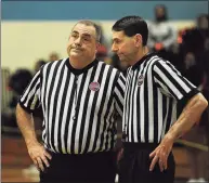  ?? Brian A. Pounds / Hearst Connecticu­t Media ?? Basketball officials Tom Sportini, left, and Craig Zysk at a Harding-Bridgeport Central boys game at Harding High School in 2018.