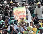  ?? PICTURE: PHILIMON BULAWAYO/REUTERS ?? JUBILANT: Supporters of Zimbabwe’s president-elect Emmerson Mnangagwa celebrate during the 38th Heroes Day Commemorat­ions at Heroes Acre in Harare yesterday.