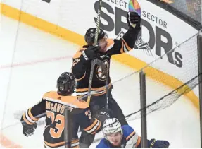  ?? BOB DECHIARA/USA TODAY SPORTS ?? Bruins forward Sean Kuraly celebrates after scoring during the third period Monday against the Blues in Boston.