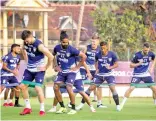  ?? ?? Chennaiyin FC players go through the paces ahead of the Bengaluru FC match